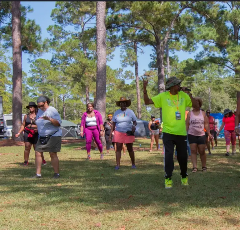 Line dancing at Melanated Campout Black adult camping weekend Cordele