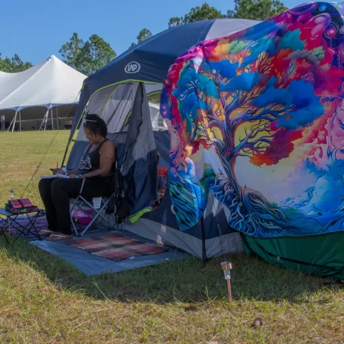 Homecoming 2026 16 black lady in front of tent during adult camping weekend